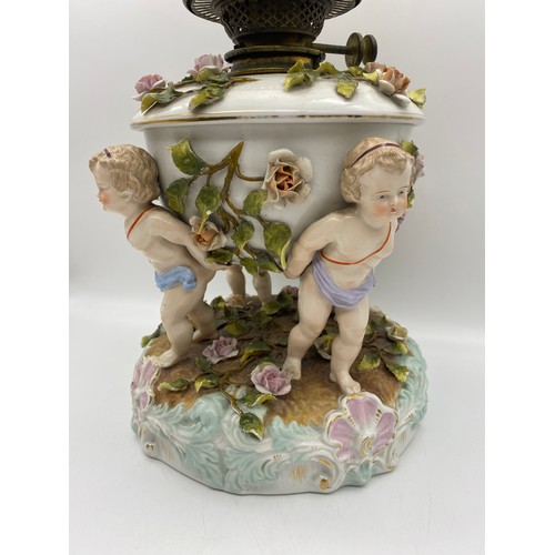 572 - SITZENDORF PUTTO AND FLORAL ENCRUSTED OIL LAMP