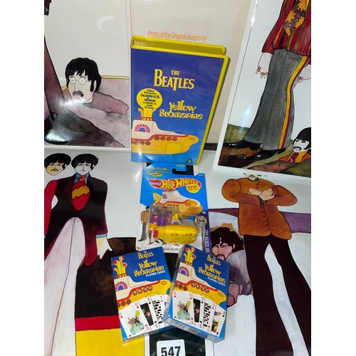 547 - THE BEATLES YELLOW SUBMARINE CHARACTER PRINTS, VHS VIDEO, PLAYING CARDS, AND HOTWHEELS YELLOW SUBMAR... 