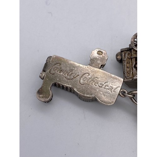 619 - BAG CONTAINING SILVER NOVELTY CHARM BRACELET INC. COVENTRY CATHEDRAL AND TWO LOOSE CHARMS 3.3 OZ APP... 