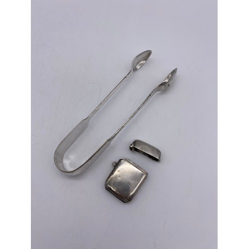 622 - SMALL SILVER VESTA CASE AND PAIR OF PLATED SUGAR TONGS