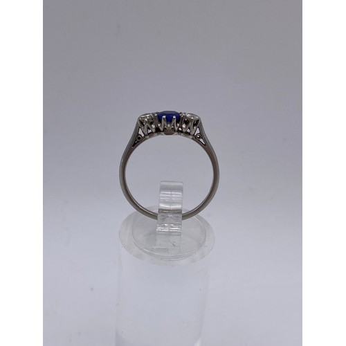 628 - PLATINUM DIAMOND AND SAPPHIRE THREE STONE RING 2.1G APPROX SIZE N