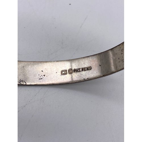 616 - SILVER ENGRAVED BANGLE AND ONE OTHER WITH SAFETY CHAIN 42G OVERALL