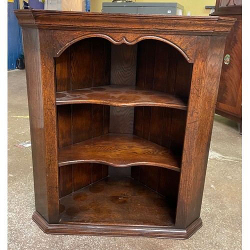 74 - OAK OPEN HANGING CORNER CABINET WITH SERPENTINE SHELVES