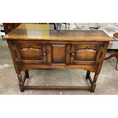 59 - GOOD QUALITY OAK MID 18TH CENTURY DESIGN SMALL DRESSER WITH FIELDED PANELLED DOORS