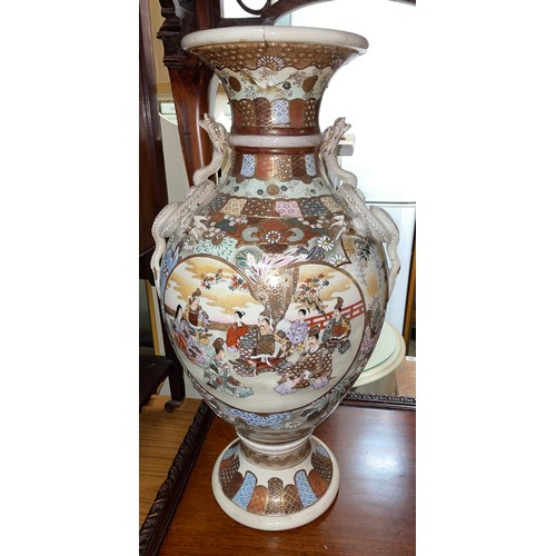 111 - EARLY 20TH CENTURY SATSUMA EATHERNWARE BALUSTER VASE WITH APPLIED DRAGON HANDLES AND PAINTED SCENES ... 