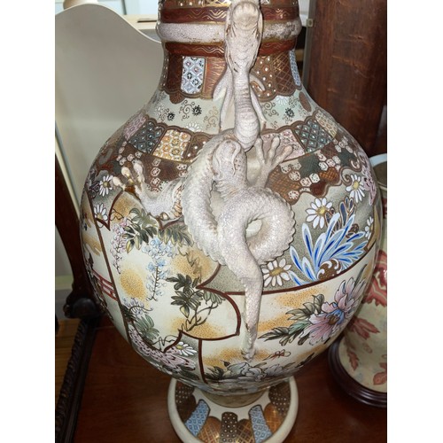 111 - EARLY 20TH CENTURY SATSUMA EATHERNWARE BALUSTER VASE WITH APPLIED DRAGON HANDLES AND PAINTED SCENES ... 