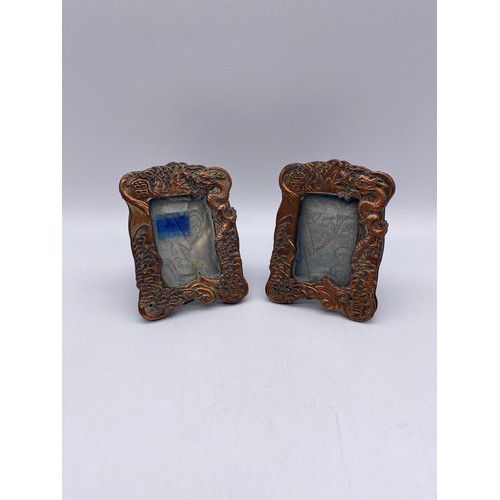 450 - PAIR OF CHINESE BAS RELIEF MINIATURE EASIL BACKED PHOTOGRAPH FRAMES