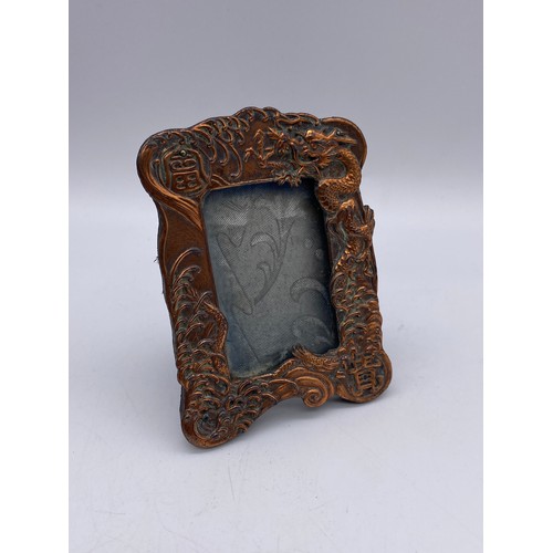 450 - PAIR OF CHINESE BAS RELIEF MINIATURE EASIL BACKED PHOTOGRAPH FRAMES