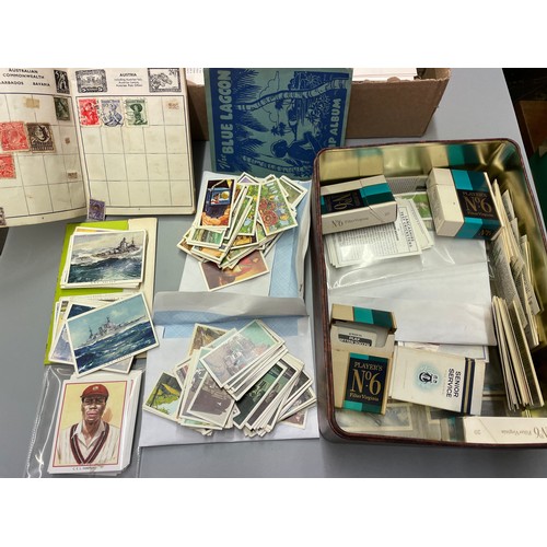 465 - TIN OF VARIOUS BROOKE BOND TEA CARDS, TWO BLUE LAGOON VINTAGE STAMP ALBUMS AND OTHER COLLECTORS CARD... 