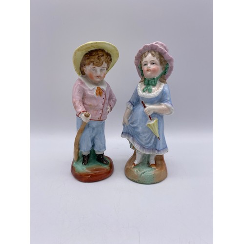 489 - PAIR OF CONTINENTAL BOY AND GIRL FIGURES, BISQUE PIANO BABY, AND A VICTORIAN FAIRING KNEELING BOY WI... 