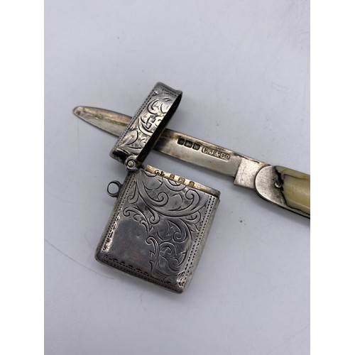 517 - BIRMINGHAM SILVER ENGRAVED VESTA CASE, SILVER BLADED POCKET KNIFE, AND A CONTINENTAL WHITE METAL FOB... 