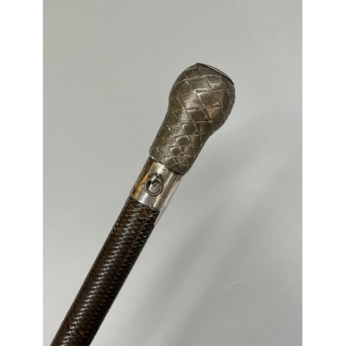 459 - WHITE METAL MOUNTED RIDING CROP