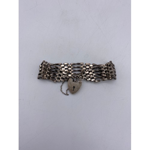 516 - SILVER FIVE BAR GATE BRACELET WITH HEART PADLOCK AND SAFETY CHAIN