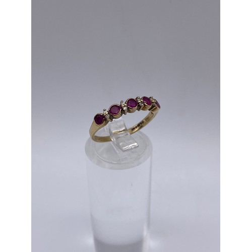 528 - 9CT GOLD CZ AND RUBY CHANNEL RING SIZE M 1.7G APPROX