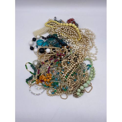 509 - TUB OF MAINLY SIMULATED PEARL AND FACET GLASS CUT BEAD NECKLACES