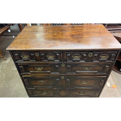 160 - 17TH CENTURY OAK GEOMETRIC FRONTED TWO OVER THREE DRAWER CHEST WITH ALTERATIONS