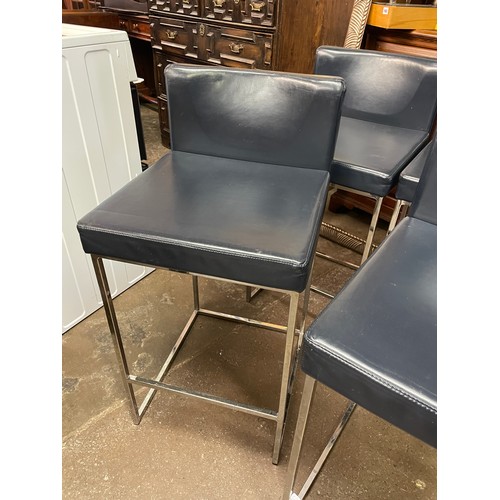 84 - FOUR BLUE UPHOLSTERED ESTEE LAUDER CHROMIUM HIGH STOOLS