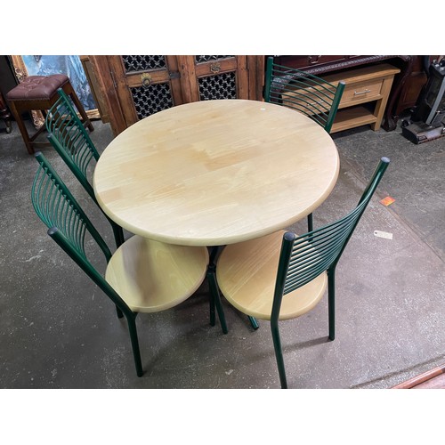 22 - BEECH AND GREEN TUBULAR CIRCULAR TABLE AND FOUR LADDER BACK CHAIRS