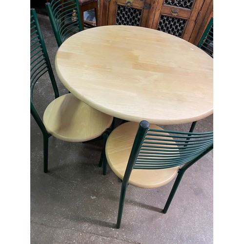 22 - BEECH AND GREEN TUBULAR CIRCULAR TABLE AND FOUR LADDER BACK CHAIRS