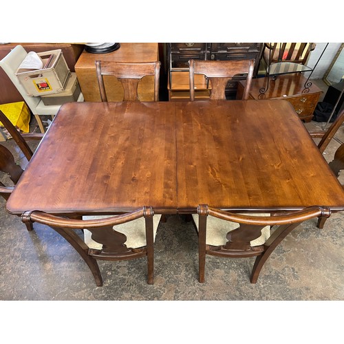 144 - DARK WALNUT TWIN PEDESTAL EXTENDING DINING TABLE AND SIX SCROLL BACK CHAIRS