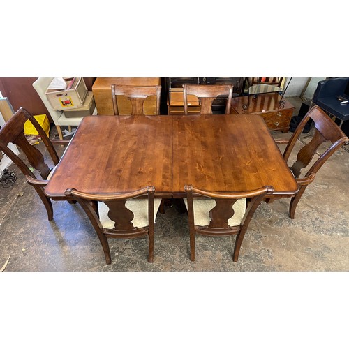 144 - DARK WALNUT TWIN PEDESTAL EXTENDING DINING TABLE AND SIX SCROLL BACK CHAIRS