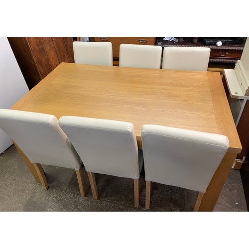 86 - CONTEMPORARY OAK DINING TABLE WITH SIX CREAM THREE LEATHERETTE HIGH BACK CHAIRS