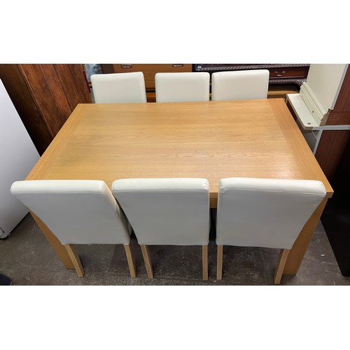 86 - CONTEMPORARY OAK DINING TABLE WITH SIX CREAM THREE LEATHERETTE HIGH BACK CHAIRS