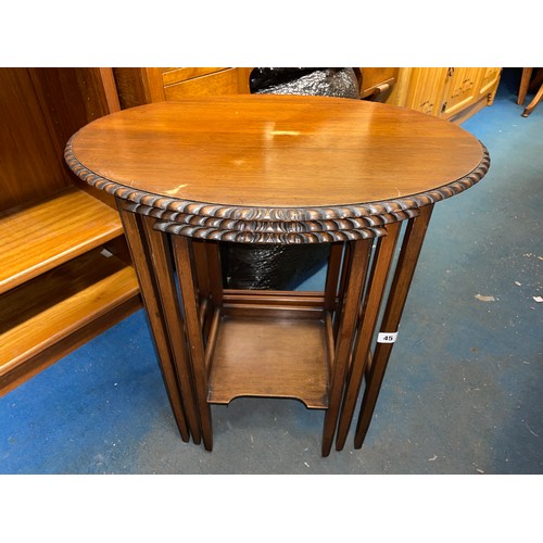 91 - MAHOGANY OVAL PIE CRUST EDGE NEST OF THREE TABLES