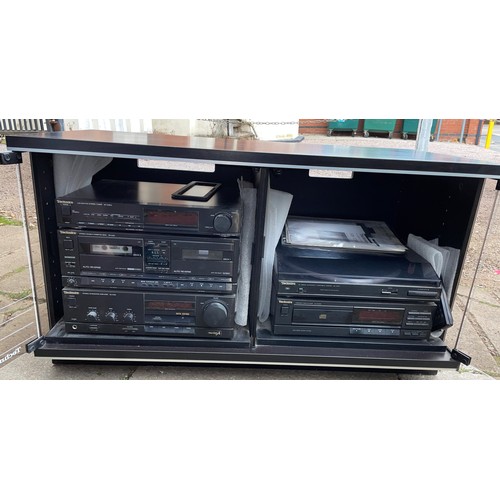 117 - BLACK ASH SMOKE GLASSED MEDIA CABINET WITH TECHNICS HIFI INSIDE INCLUDING AMPLIFIER, TUNER AND TURNT... 