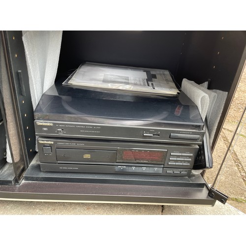 117 - BLACK ASH SMOKE GLASSED MEDIA CABINET WITH TECHNICS HIFI INSIDE INCLUDING AMPLIFIER, TUNER AND TURNT... 