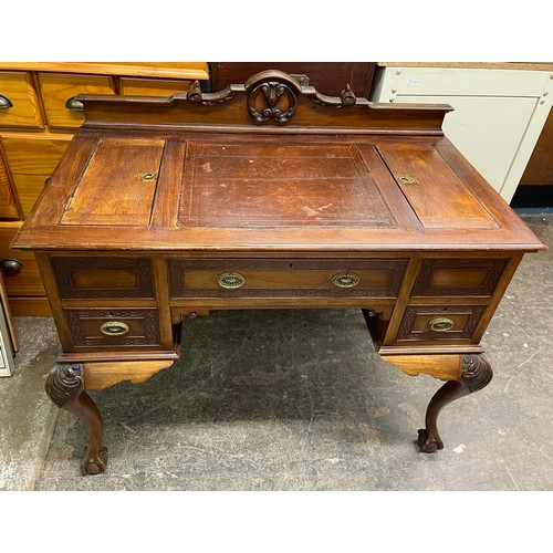 73 - EDWARDIAN MAHOGANY KNEEHOLE DESK WITH LEATHER SKIVER GALLERY BACK AND BLIND FRET CARVED DRAWER FRONT... 