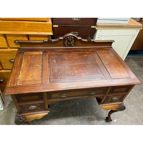 73 - EDWARDIAN MAHOGANY KNEEHOLE DESK WITH LEATHER SKIVER GALLERY BACK AND BLIND FRET CARVED DRAWER FRONT... 