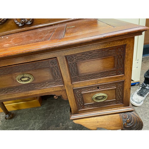 73 - EDWARDIAN MAHOGANY KNEEHOLE DESK WITH LEATHER SKIVER GALLERY BACK AND BLIND FRET CARVED DRAWER FRONT... 