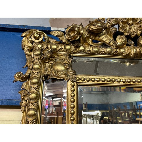 230 - GILT GESSO FLORENTINE STYLE MIRROR WITH FLORAL EGG AND DART DECORATION 120CM X 83CM