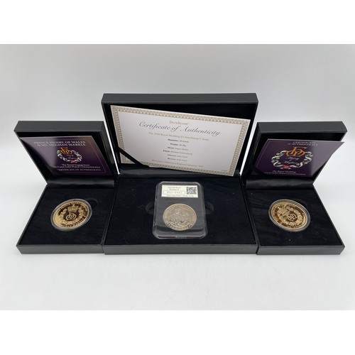 560 - TWO PRINCE HARRY AND MEGAN MARKLE ROYAL ENGAGEMENT GOLD PLATED COMMEMORATIVE PROOF COINS AND A £5 PR... 