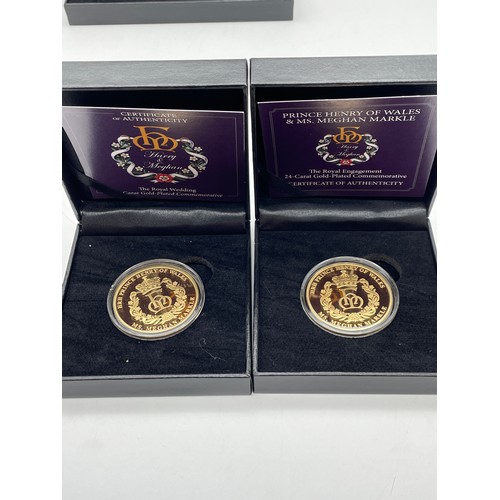 560 - TWO PRINCE HARRY AND MEGAN MARKLE ROYAL ENGAGEMENT GOLD PLATED COMMEMORATIVE PROOF COINS AND A £5 PR... 