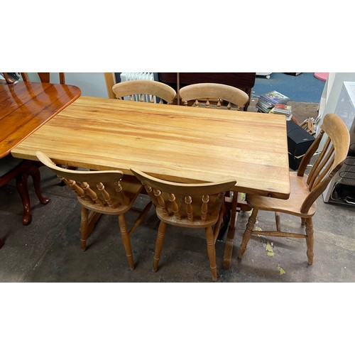 155 - PINE FARMHOUSE KITCHEN TABLE AND SIX SPINDLE BACK CHAIRS