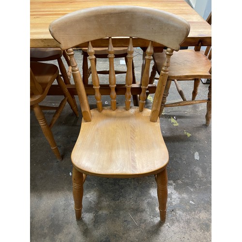 155 - PINE FARMHOUSE KITCHEN TABLE AND SIX SPINDLE BACK CHAIRS