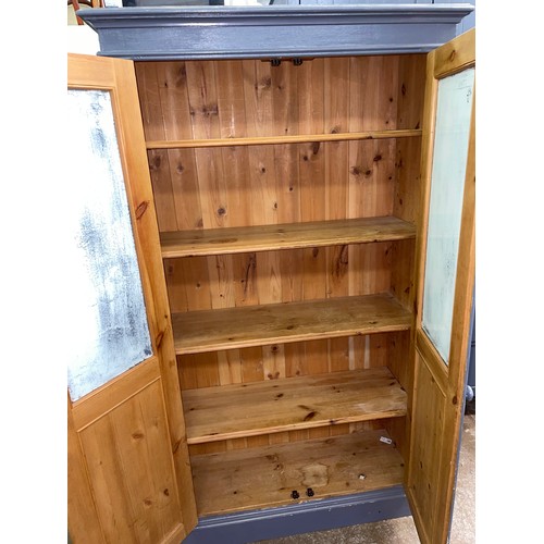 81 - BLUE PAINTED PINE PANELLED CUPBOARD