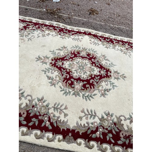 279 - LARGE CREAM AND RED PATTERN WOOLLEN CARPET 275cm x 188cm