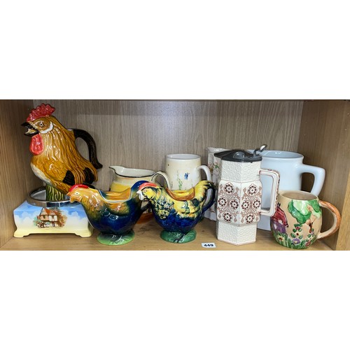 331 - SHELF OF POTTERY JUGS INCLUDING HENS AND COCKEREL