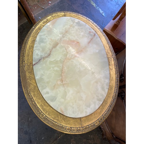 227 - FRENCH STYLE GILDED OVAL OCCASIONAL TABLE WITH INSET ONYX TOP