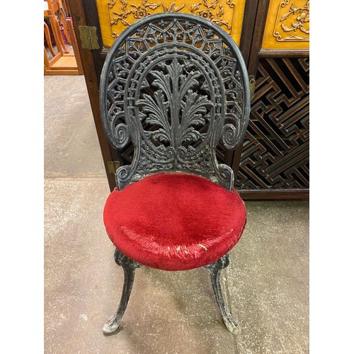 82 - TWO CAST IRON FERN BACK PATIO CHAIRS