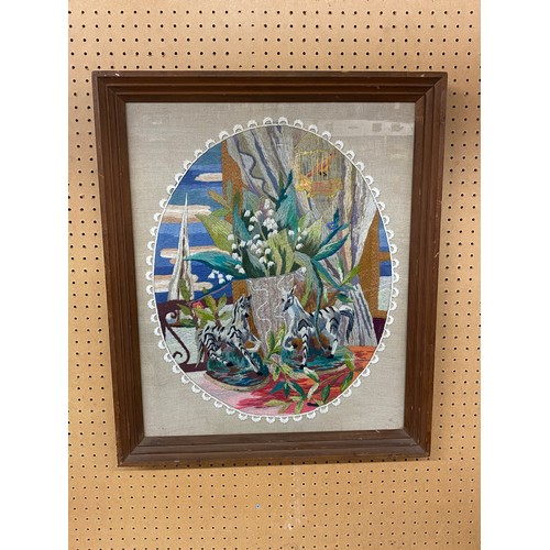 548 - NEEDLE WORKED OVAL AND LACE PANEL OF BIRD IN A CAGE AND ANIMALS FRAMED AND GLAZED