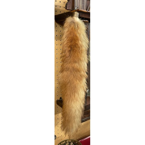 613 - TAXIDERMIC FOX HEAD MOUNTED ON A SHIELD SHAPE PLAQUE WITH FOX TAIL BRUSH
