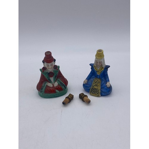 752 - PAIR OF CONTINENTAL SEATED MANDARIN FIGURE SCENT PHIALS 9cm