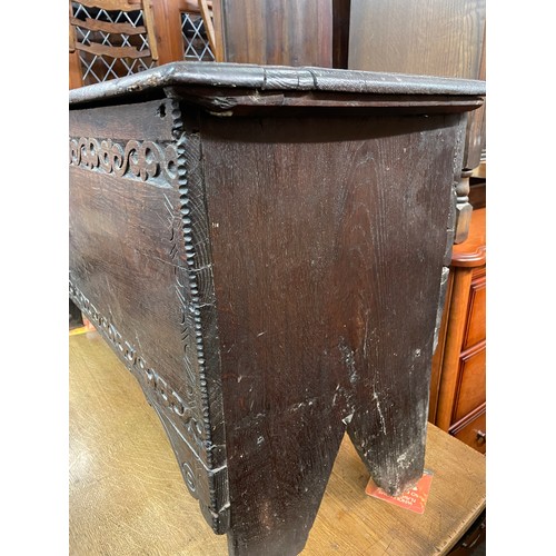 79 - 17TH CENTURY OAK SIX PLANK CHEST WITH CHIP CARVED AND GUILLOCHE DECORATION