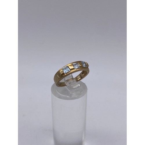 747 - 9CT GOLD THREE STONE TOPAZ RING 2.2G APPROX