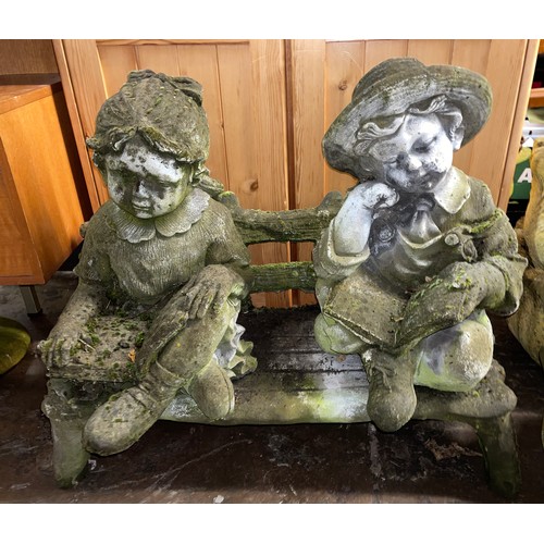 215 - STONE SEATED BOY AND GIRL ON BENCH FIGURE GROUP