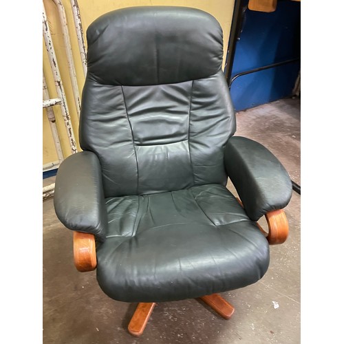 75 - STRESSLESS TYPE DARK GREEN LEATHER SWIVEL CHAIR AND FOOTSTOOL